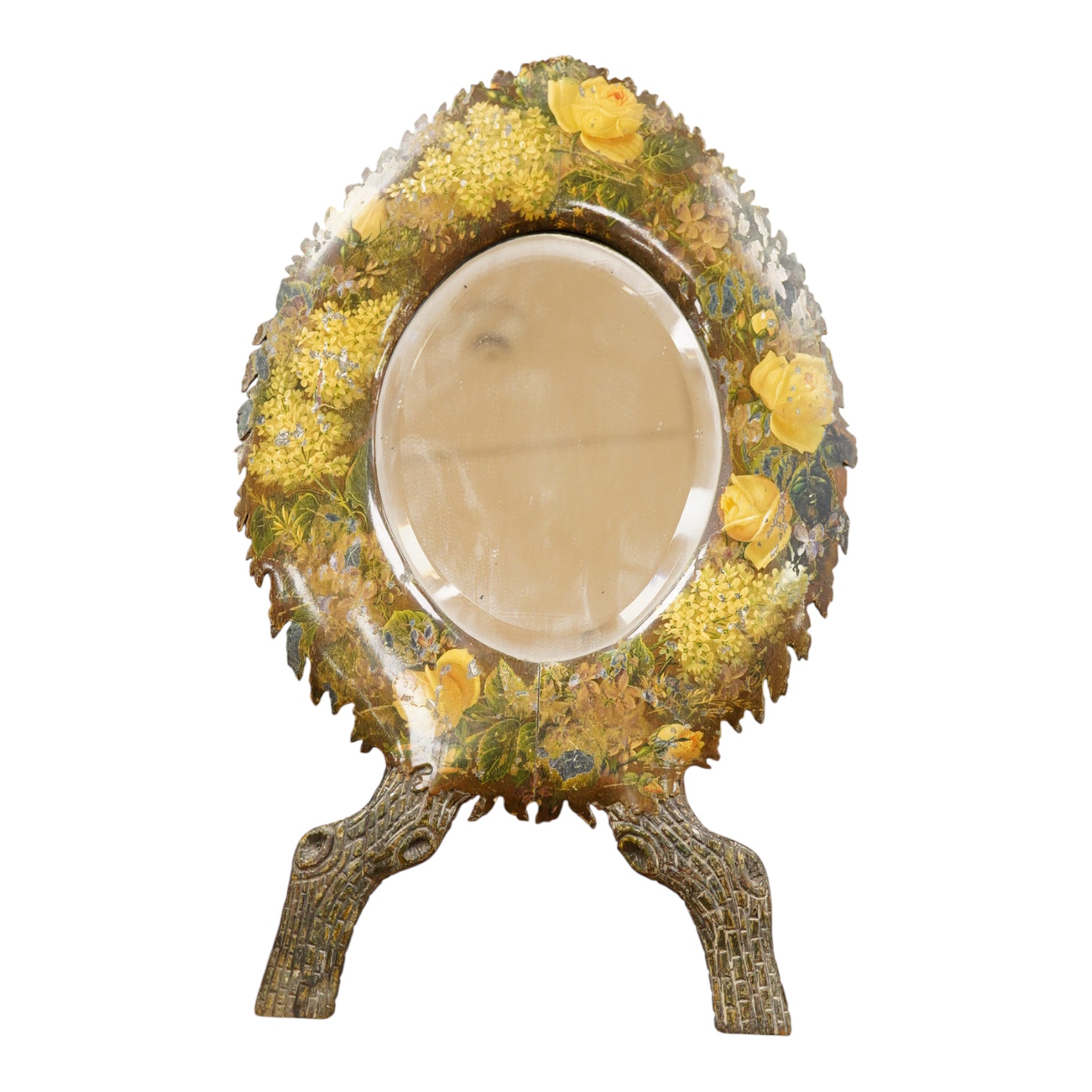 A dressing mirror, naturalistically designed with painted foliate decoration and branch effect legs, 42cm high
